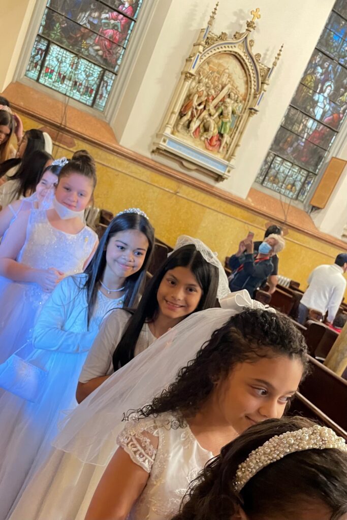 Girls with hands crossed waiting for the first communion